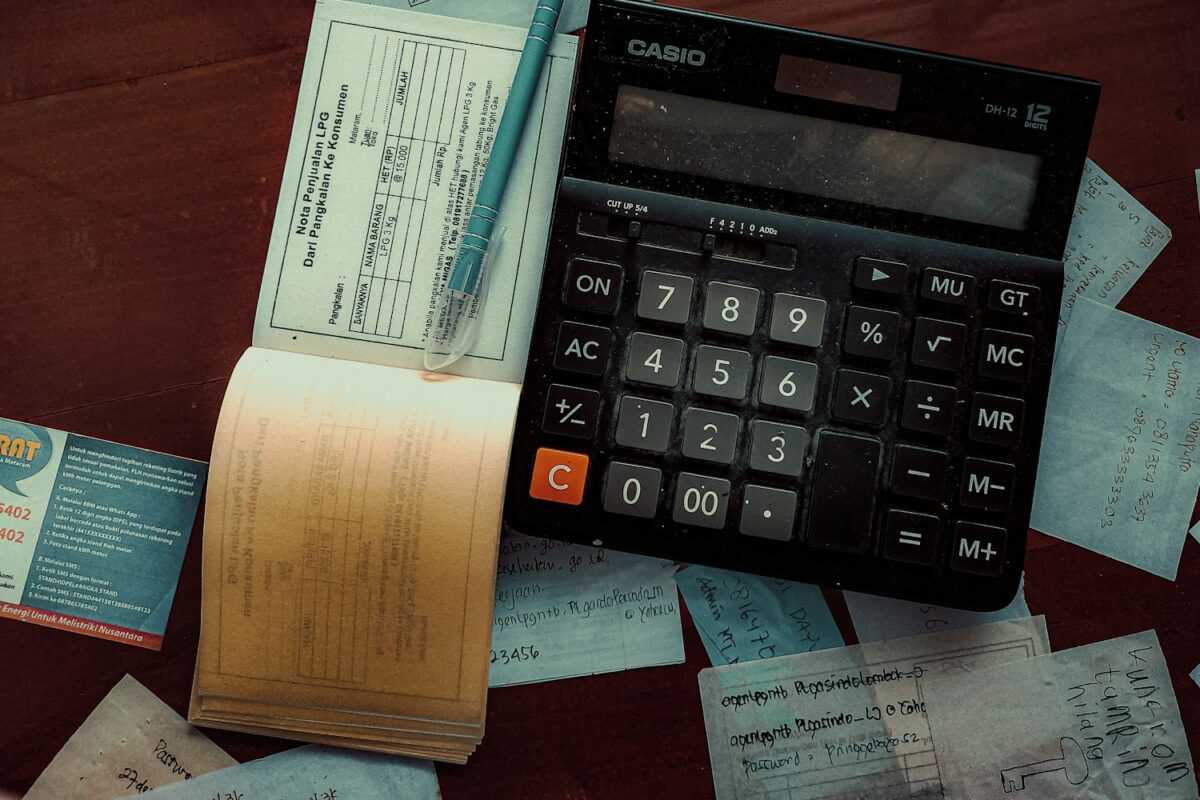 a calculator sitting on top of a wooden table