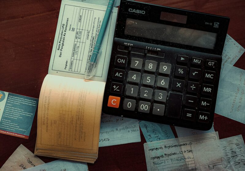 a calculator sitting on top of a wooden table