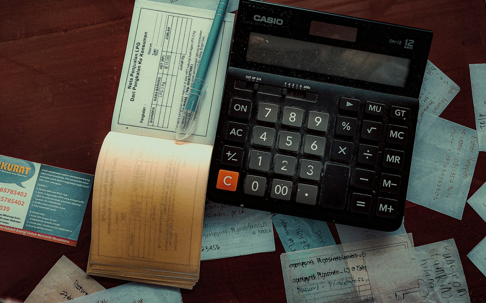 a calculator sitting on top of a wooden table