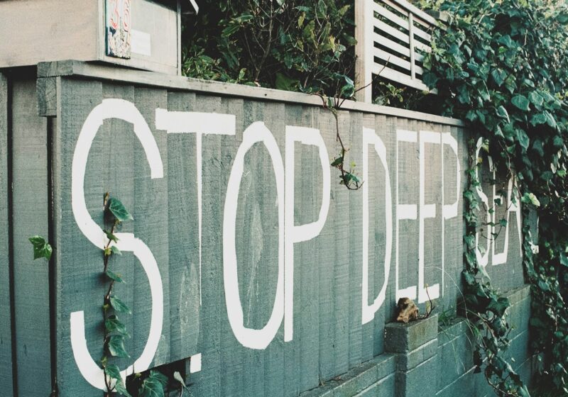 A stop sign painted on the side of a building