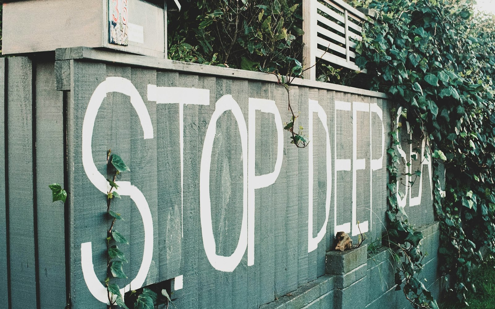 A stop sign painted on the side of a building