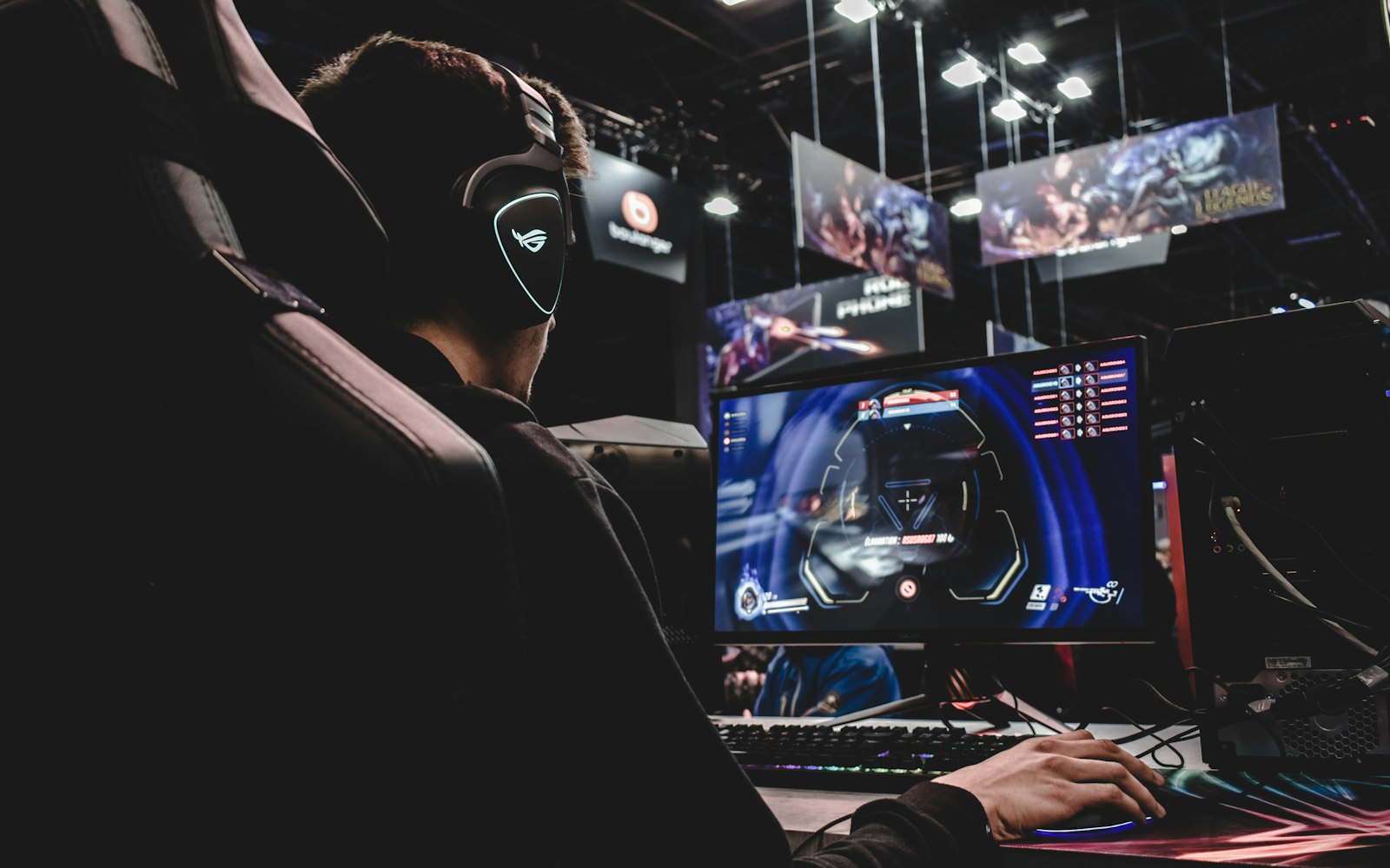 person sitting on gaming chair while playing video game